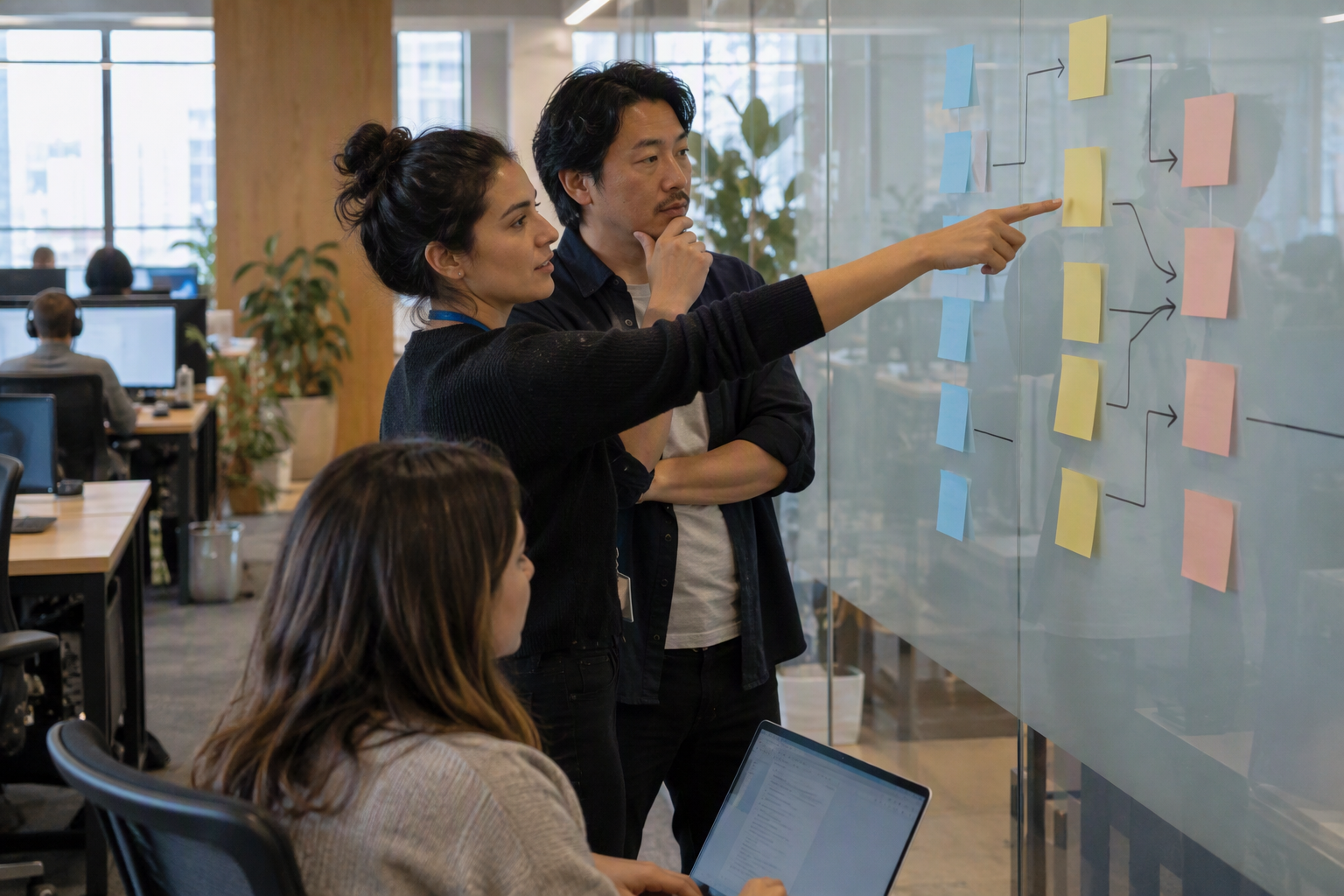 Show a customer-support lead and an AI product manager mapping a narrow FAQ and order-status workflow on a glass planning